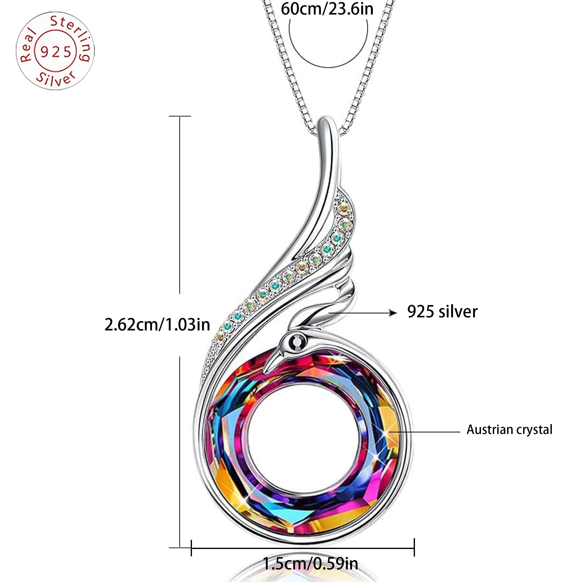 Ce collier est orné d'un pendentif circulaire en zircone synthétique de couleurs phénix, fabriqué en argent sterling S925. Il est idéal pour un usage quotidien et constitue un magnifique cadeau pour des occasions comme la Saint-Valentin, la fête des mères, les anniversaires.